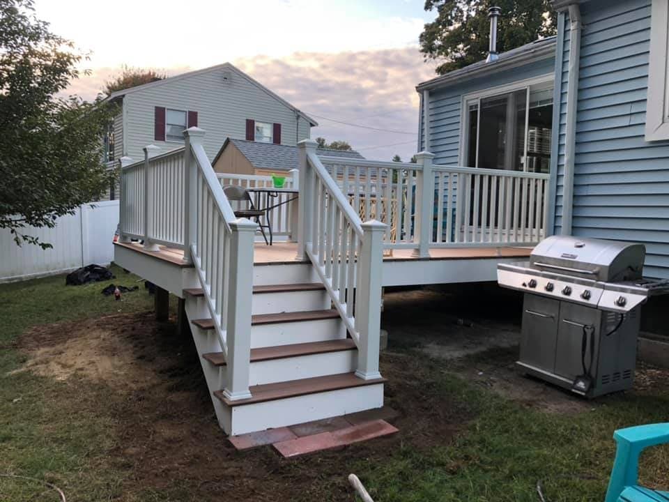 Deck stairs with composite treads and white rail