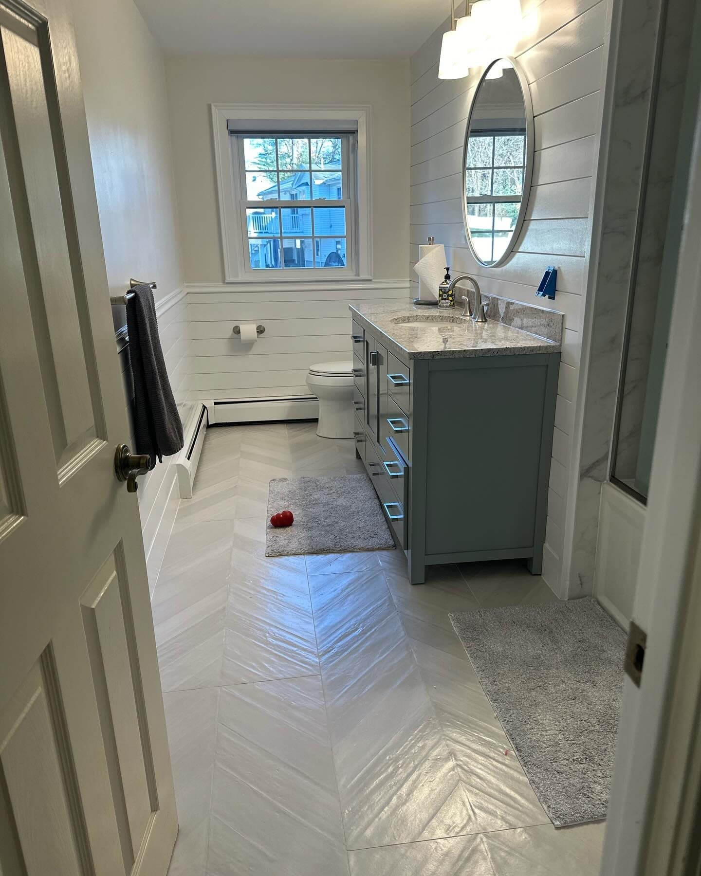 Bathroom with herringbone tile floor