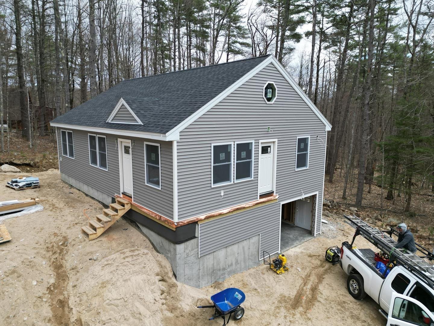 New home framed, sided and roofed on a fresh foundation