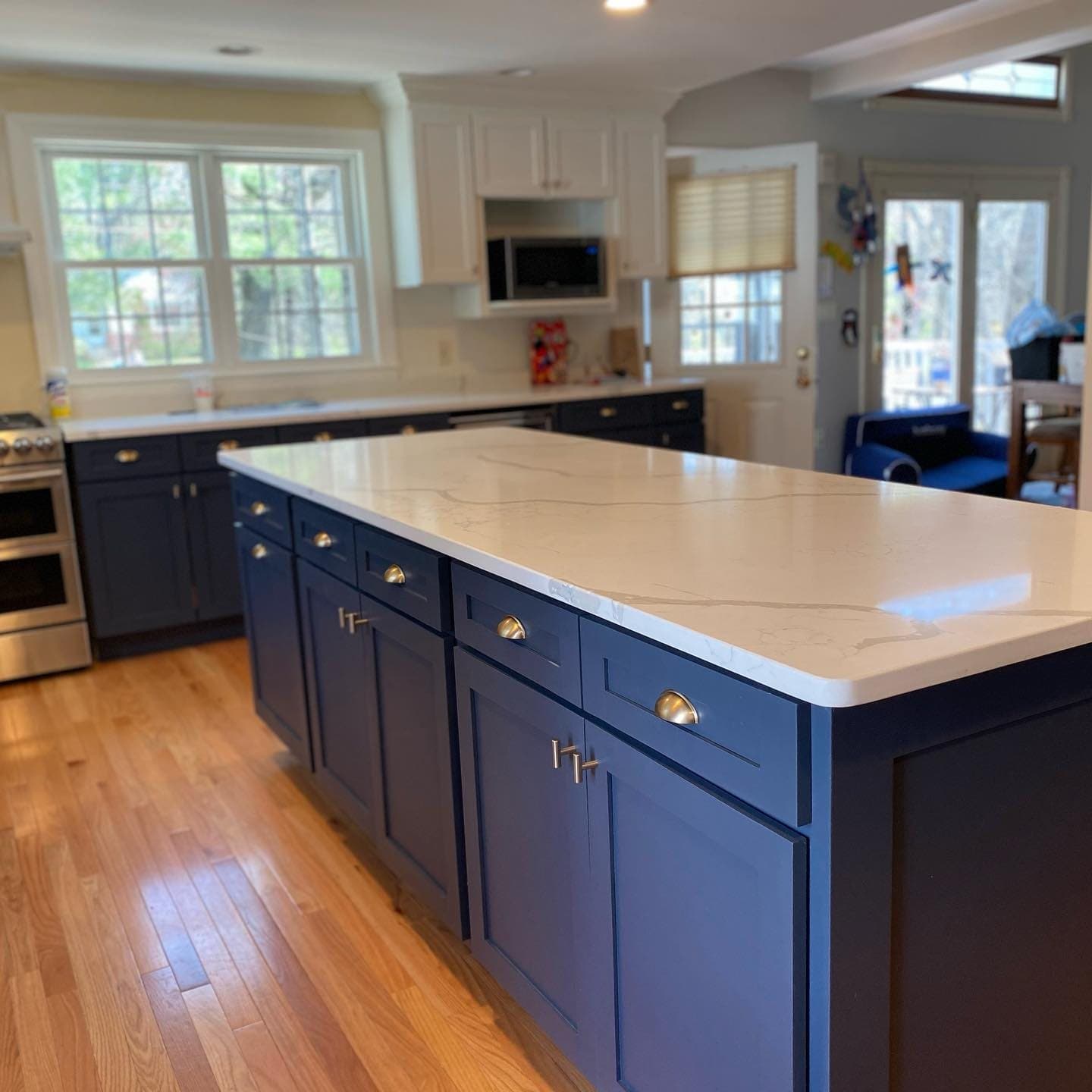 Navy kitchen island with white counters